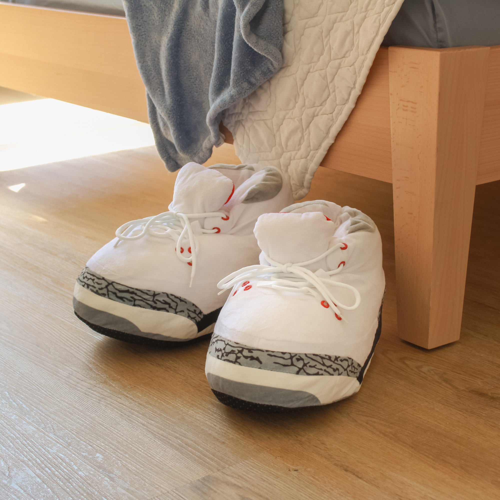 Yours 2 Keep White Marble Sneaker Slippers next to bed