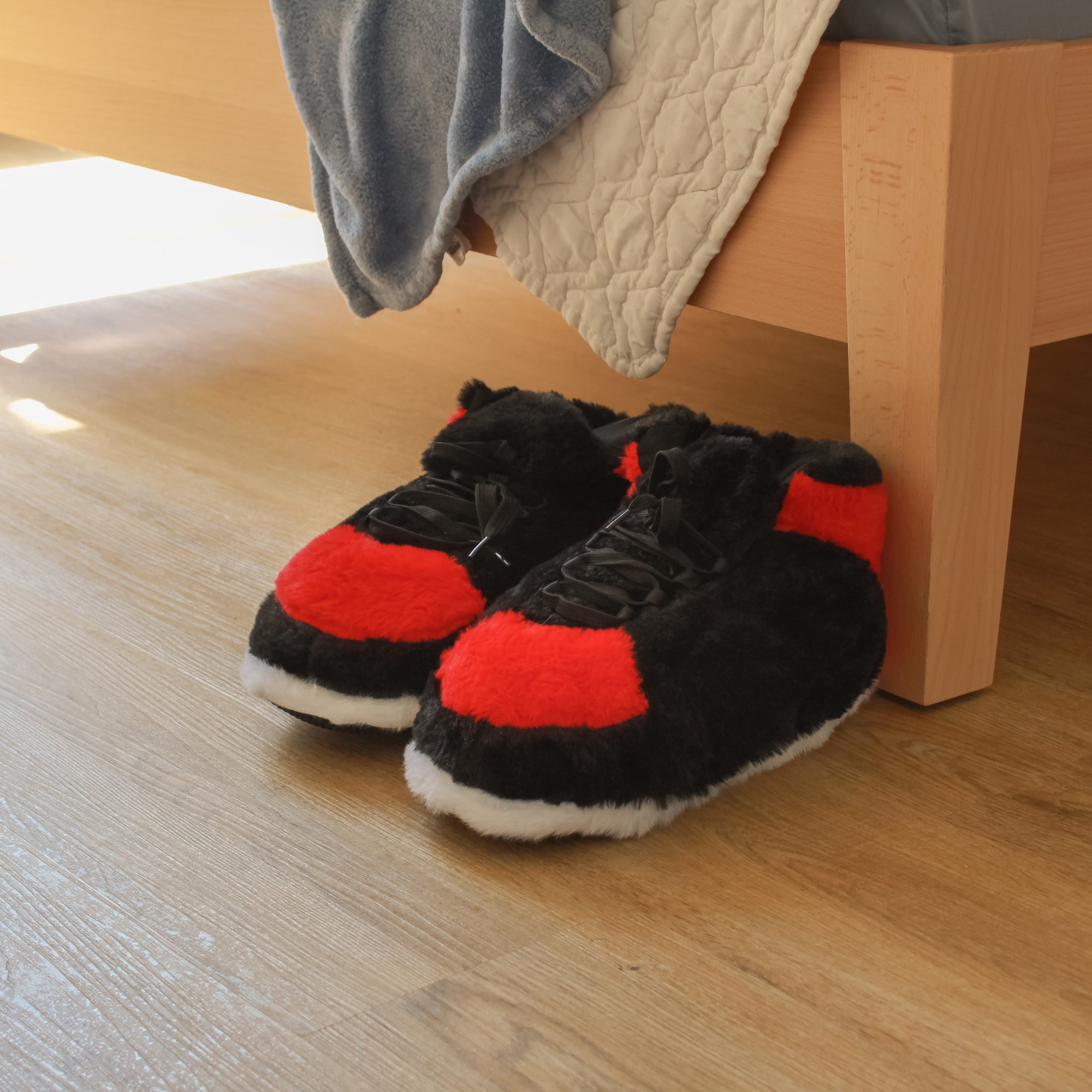 Yours 2 Keep Bred Sneaker Slippers next to bed