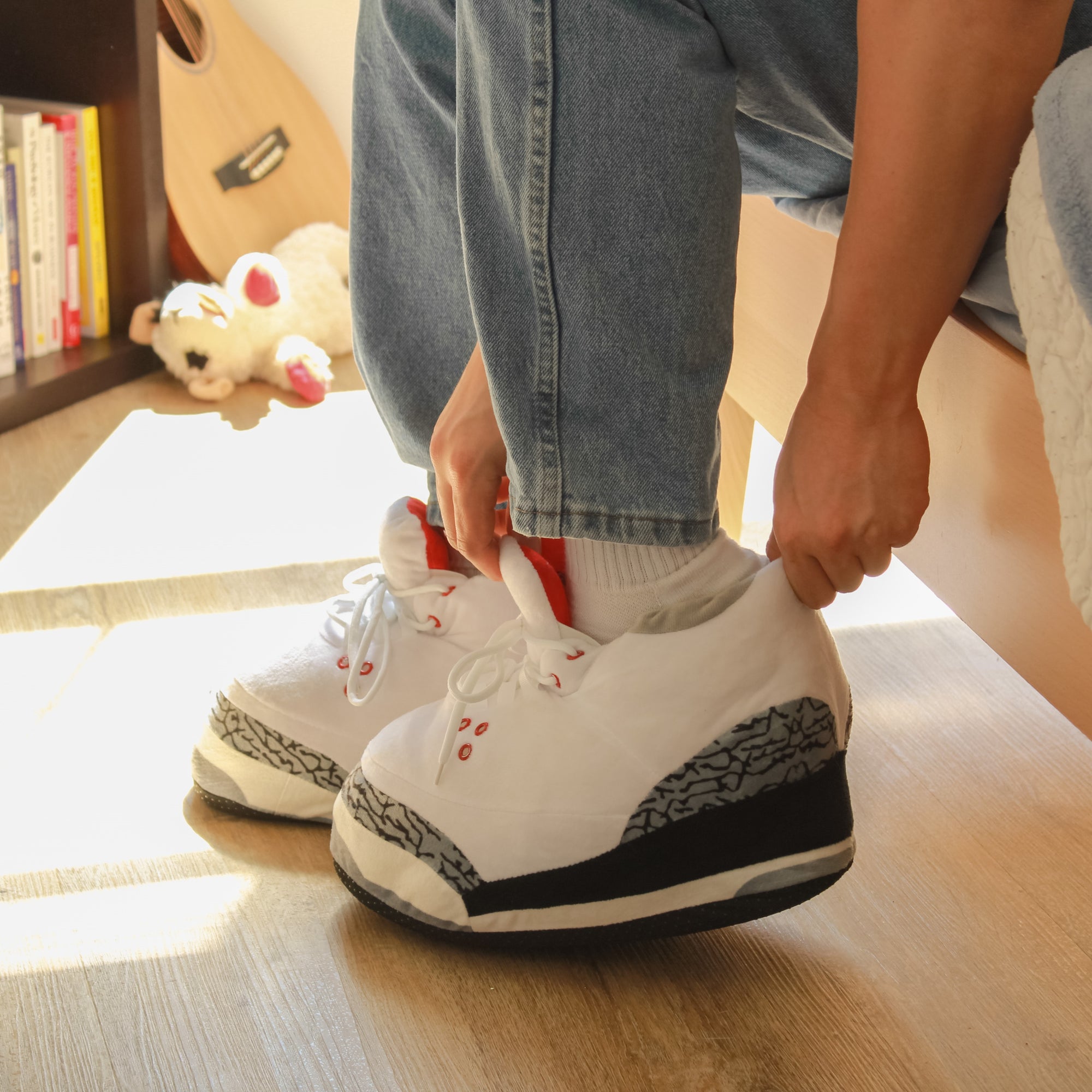 Model putting on Yours 2 Keep White Marble Sneaker Slippers