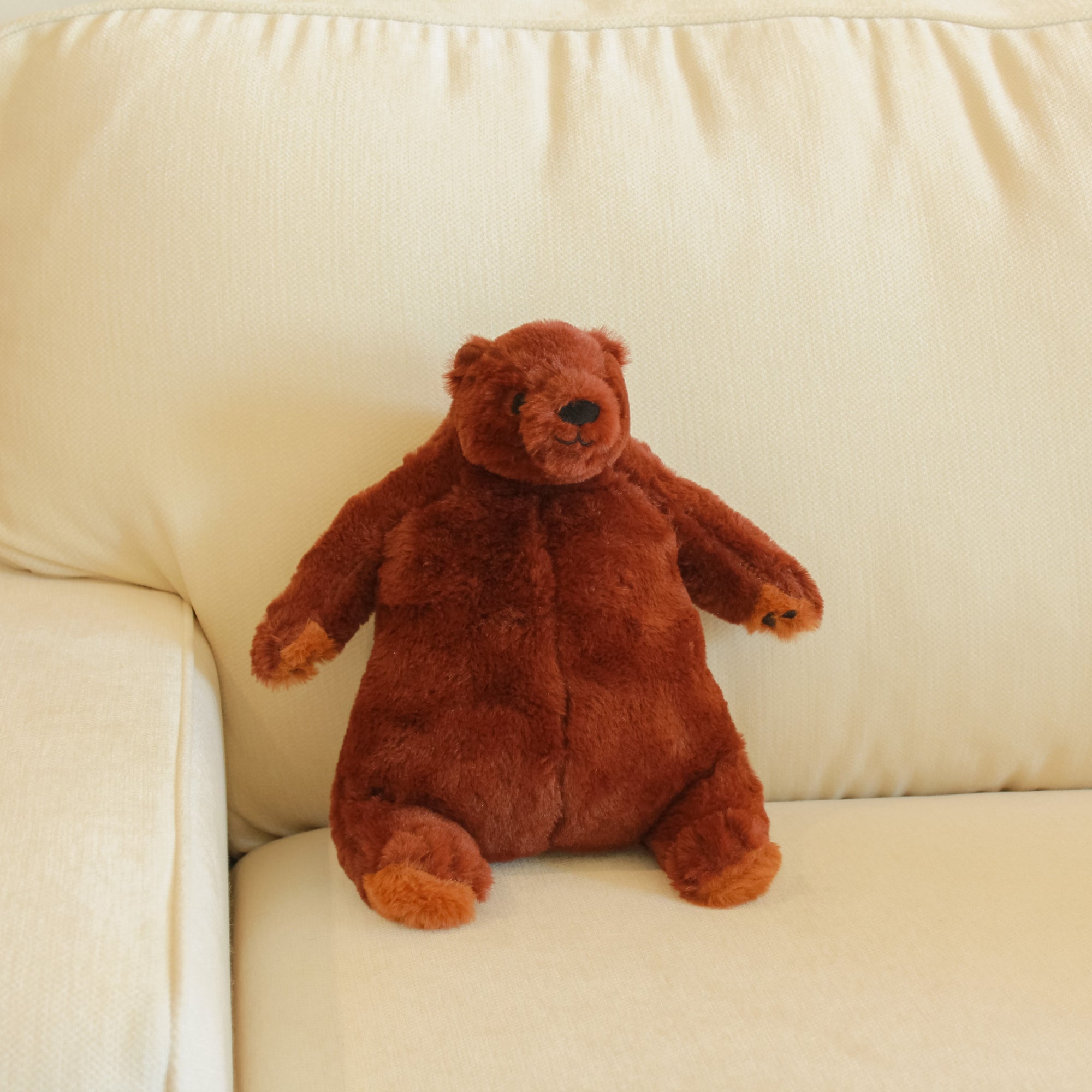 Yours 2 Keep Sleepy Bear sitting on couch